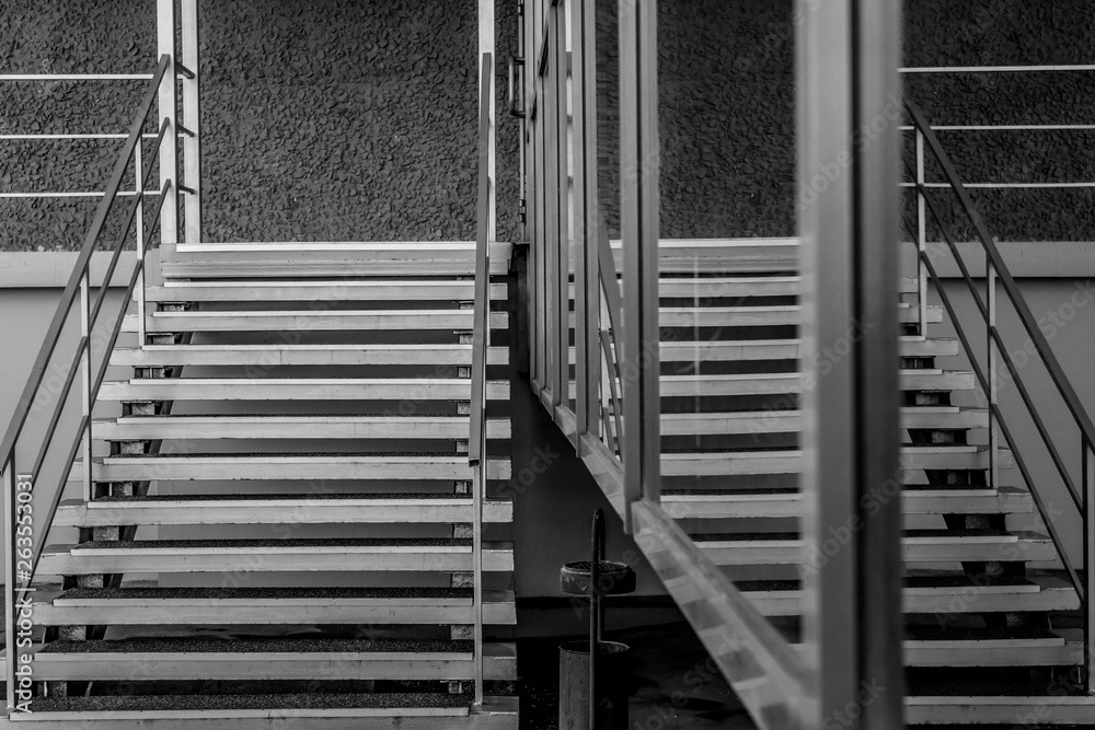 The reflection of the stairs in the windows of the building The reflection of the stairs in the windows of the building