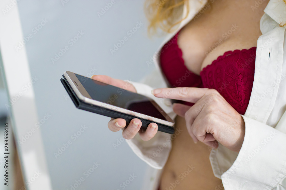 Naklejka premium sexy woman with mobile phone