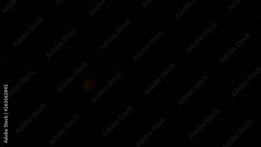 Salted crackers fly after being exploded. Pile of golden cookies snacks bouncing against camera and falling down on black background. Top view slow motion Salted crackers fly after being exploded. Pile of golden cookies snacks bouncing against camera and falling down on black background. Top view slow motion