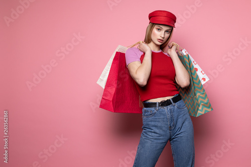 Photo of elegant woman in red hat and trendy outfit