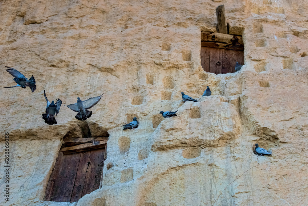 An ancient tradition, naturally cool stone carved warehouses along with many pigeon lofts in Ermenek, Turkey An ancient tradition, naturally cool stone carved warehouses along with many pigeon lofts in Ermenek, Turkey