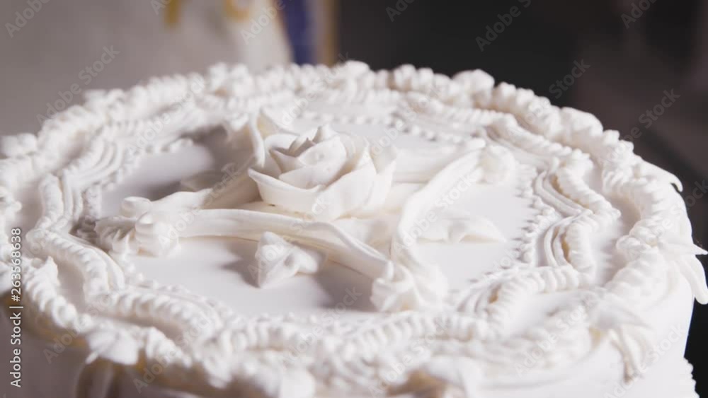 CU of rose icing on wedding cake CU of rose icing on wedding cake