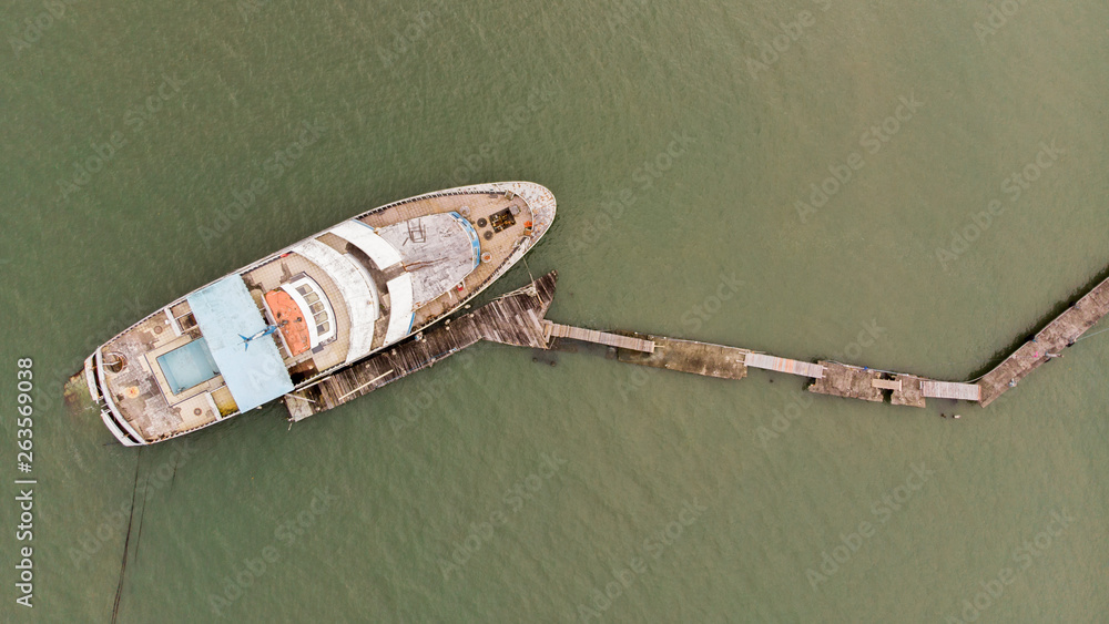 Drone view of an old yacht sunken.