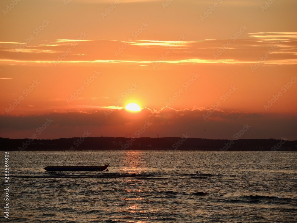 sunset at the seaside with a boat