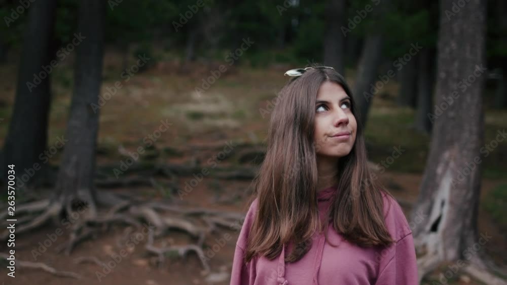 Portrait of a teenage girl in pine forest Portrait of a teenage girl in pine forest