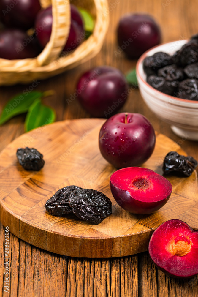 Dried Plums Pitted Prunes and Fresh Plums. Selective focus. Dried Plums Pitted Prunes and Fresh Plums. Selective focus.
