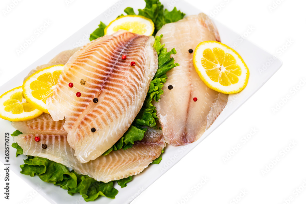 Whitefish Tilapia Fish Raw Fillet Isolated on White. Selective focus. Whitefish Tilapia Fish Raw Fillet Isolated on White. Selective focus.