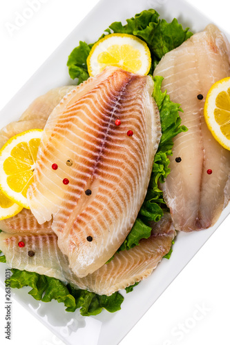 Whitefish Tilapia Fish Raw Fillet Isolated on White. Selective focus.