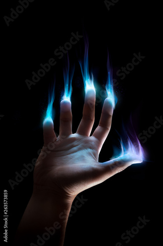 hand with supernatural powers on a dark background photo