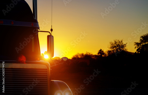 Close up shot the front of a truck against sunset