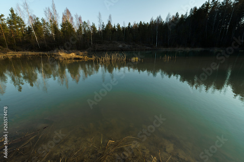 Fototapeta Naklejka Na Ścianę i Meble -  Beautiful turquoise lake in Latvia - Meditirenian style colors in Baltic states - Lackroga ezers