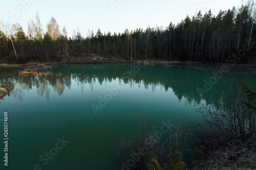 Fototapeta Naklejka Na Ścianę i Meble -  Beautiful turquoise lake in Latvia - Meditirenian style colors in Baltic states - Lackroga ezers