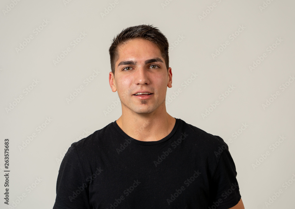 Portrait of attractive cheerful young man with smiling happy face. Human expressions and emotions Portrait of attractive cheerful young man with smiling happy face. Human expressions and emotions