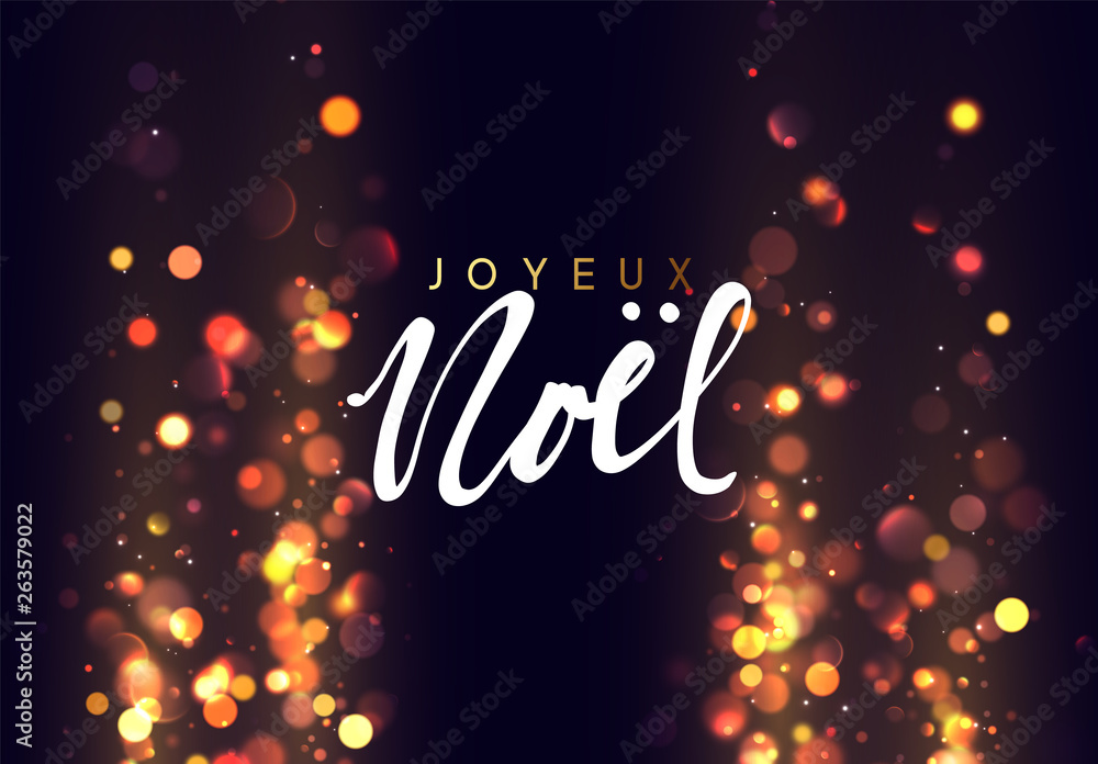 French text Joyeux Noel. Christmas background with golden lights bokeh.