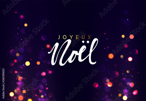 French text Joyeux Noel. Christmas background with golden lights bokeh.