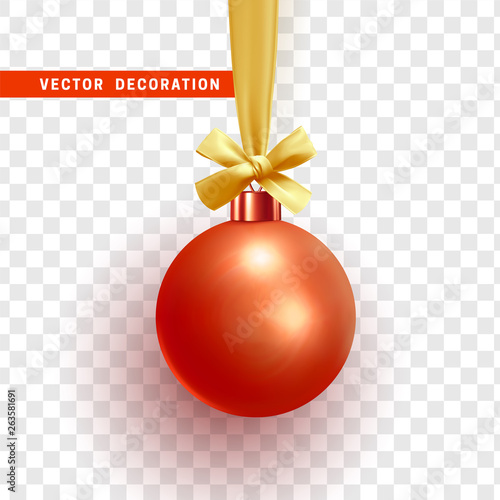 Christmas ball hanging on ribbon with golden bow.