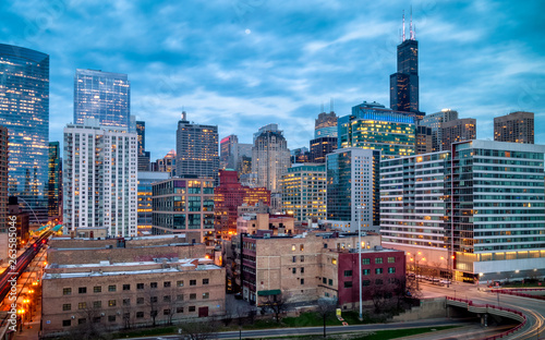 Blue Hour evening cityscape in West Loop neighborhood. Long exposure, nightscape architecture. Main street in Chicago, streets in Illinois.