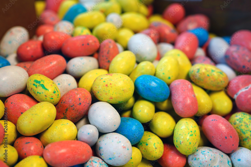 Small colorful chocolate eggs in hard sugar shell in bulk for Easter Small colorful chocolate eggs in hard sugar shell in bulk for Easter