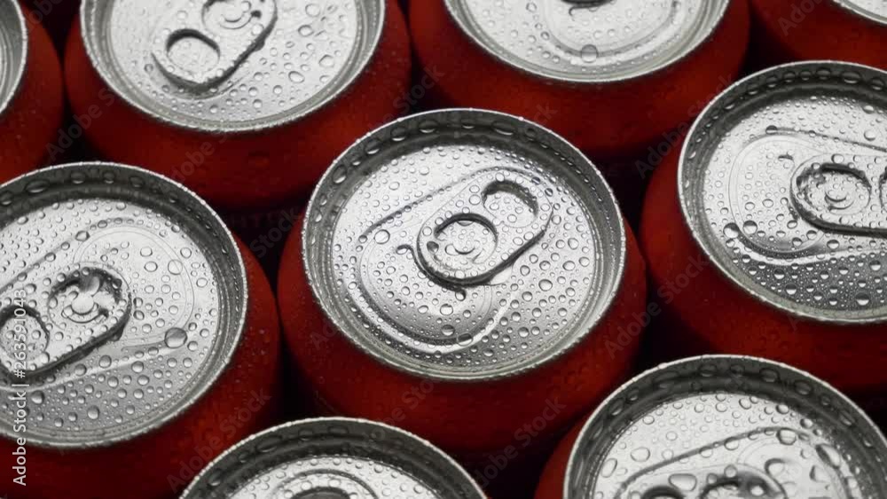 top view water droplets on red can of soda or beer rotate background. Slow motion video dolly crane shot medium extreme close up panorama high angle telephoto lens top view water droplets on red can of soda or beer rotate background. Slow motion video dolly crane shot medium extreme close up panorama high angle telephoto lens