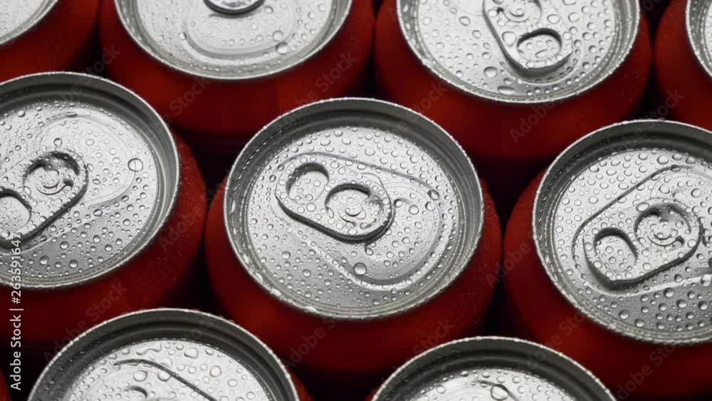 top view water droplets on red can of soda or beer rotate background. Slow motion video dolly crane shot medium extreme close up panorama high angle telephoto lens top view water droplets on red can of soda or beer rotate background. Slow motion video dolly crane shot medium extreme close up panorama high angle telephoto lens
