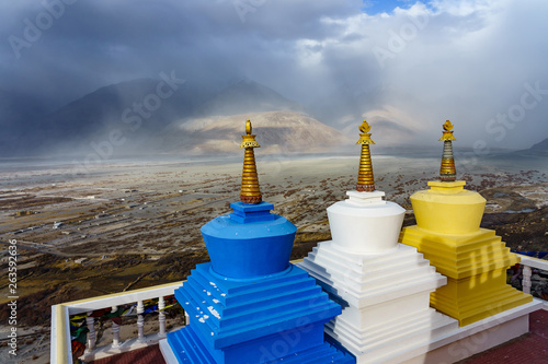 View of Three stupa with Nubra Valley in the background. Taken from Diskit Monastery in Ladakh, India.