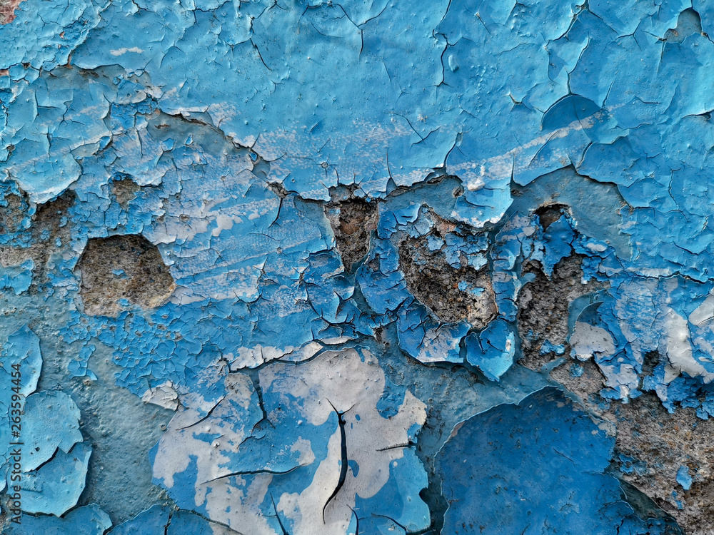 Blue background with cracked oil paint on plaster. Blue background with cracked oil paint on plaster.