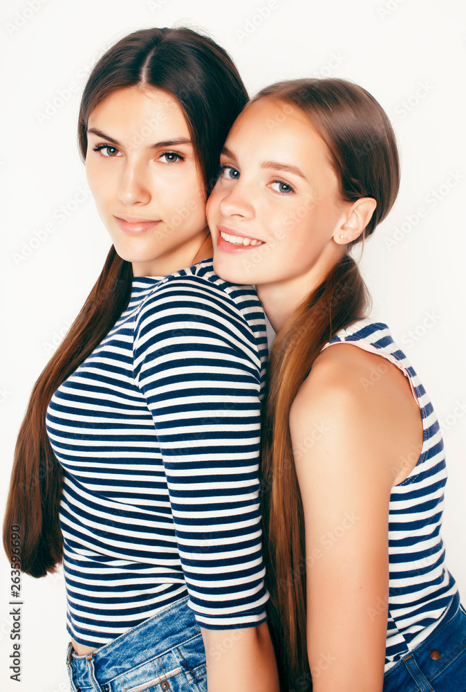 best friends teenage girls together having fun, posing emotional on white background, besties happy smiling, lifestyle people concept best friends teenage girls together having fun, posing emotional on white background, besties happy smiling, lifestyle people concept