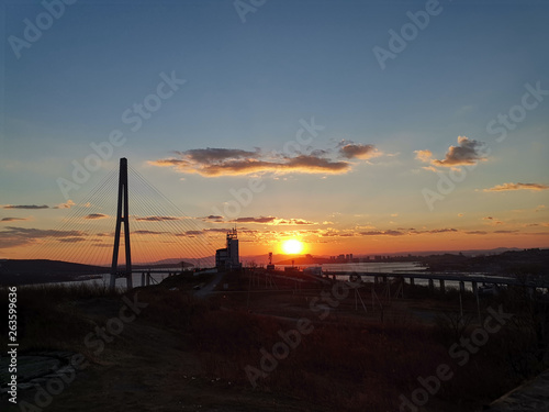 Silhouette of the Russian bridge at sunset.