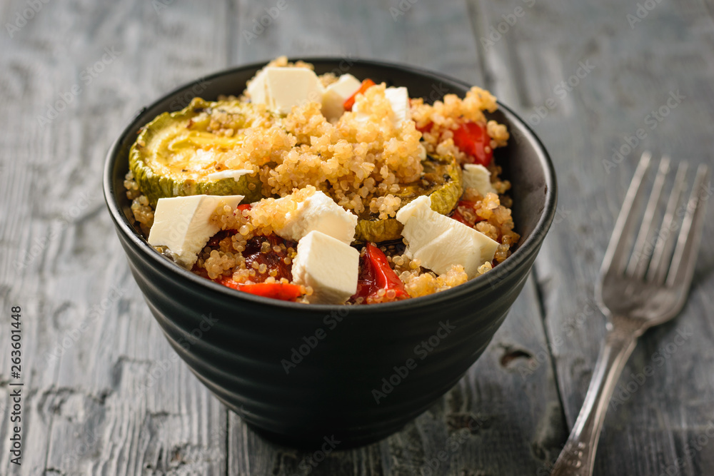 Salad of boiled quinoa cereals, vegetables and pieces of Serbian cheese. Vegetarian dish. Natural plant food. Salad of boiled quinoa cereals, vegetables and pieces of Serbian cheese. Vegetarian dish. Natural plant food.