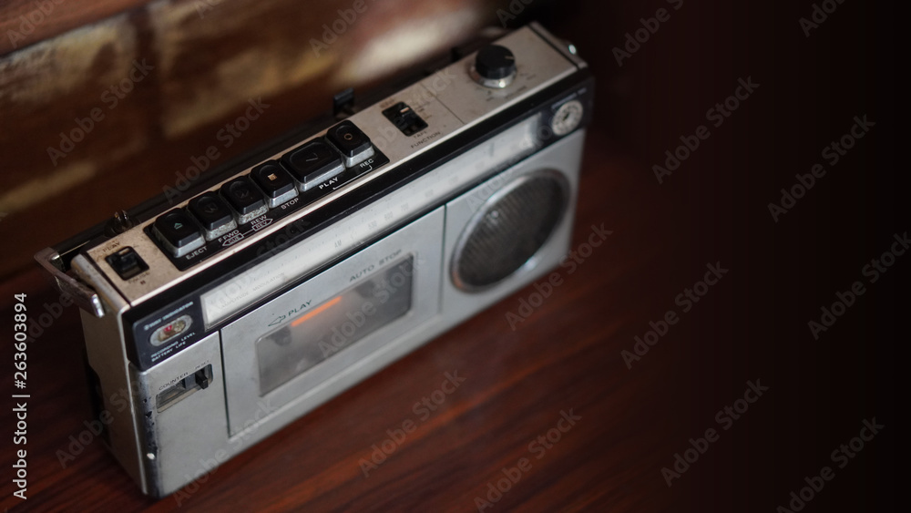 Fototapeta premium top view old radio on wooden background,copy space