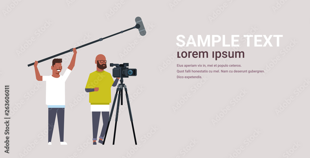 Ταπετσαρία operators using video camera on tripod holding microphone african american men w