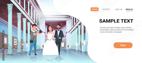 wedding photographer shooting on camera newlyweds man woman standing together romantic couple bride and groom embracing man taking professional photo museum hall interior horizontal copy space