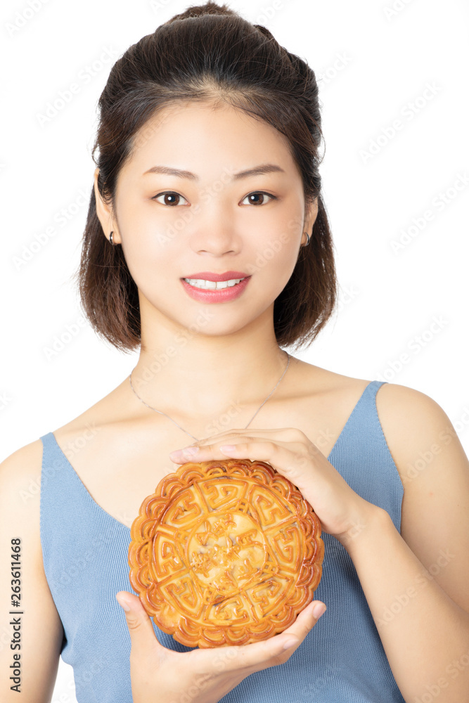 Chinese woman holding Moon Cake isolated on a white background Chinese woman holding Moon Cake isolated on a white background