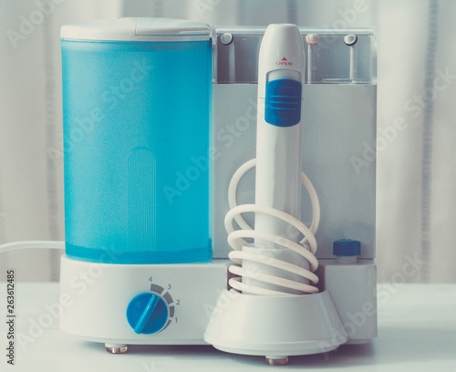 Irrigator for cleaning teeth. Oral hygiene.