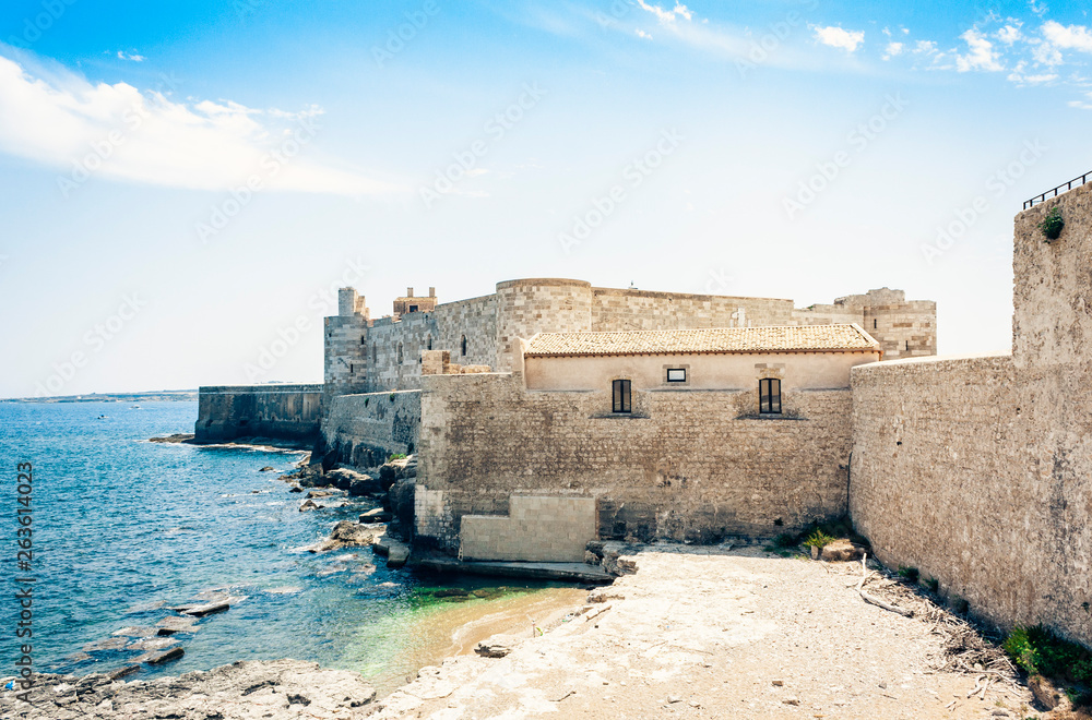 Castello Maniace – ancient castle in Ortygia (Ortigia) Island, Syracuse, Sicily, Italy, traditional architecture. Castello Maniace – ancient castle in Ortygia (Ortigia) Island, Syracuse, Sicily, Italy, traditional architecture.