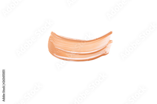 Beige smear of foundation. Cosmetics concept isolated on white background.