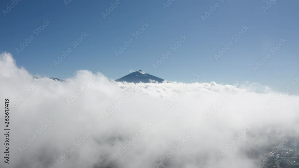 Aerial view on the peak of the volcano Teide on Tenerife, covered with clouds. Aerial view on the peak of the volcano Teide on Tenerife, covered with clouds.
