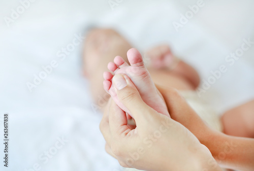 Foot massage for baby. Health care concept. © zilvergolf