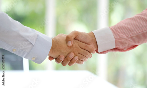 Businessman handshake at office, business cooperation, success in business concept