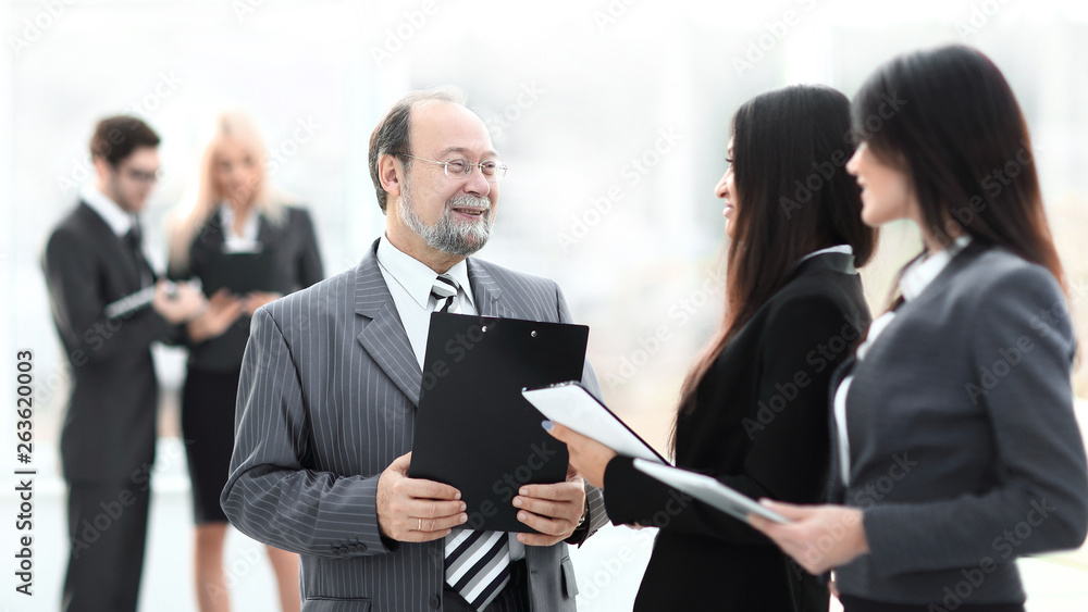 close up.group of business people standing in lobby of office. close up.group of business people standing in lobby of office.