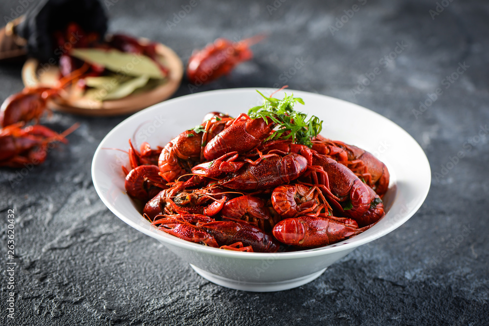 Red spicy crayfish in a white dish