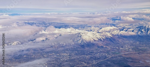 Εκτύπωση καμβά Aerial view from airplane of the Wasatch Front Rocky Mountain Range with snow capped peaks in winter including urban cities of Provo, Farmington Bountiful, Orem and Salt Lake City