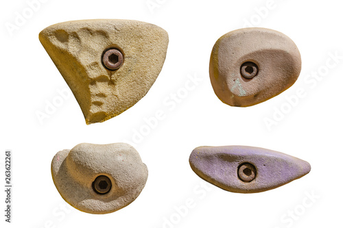 Set of grips different colors and shapes for climbing wall isolated on white background