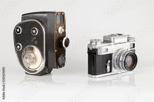 Old vintage photo and video camera on a white background