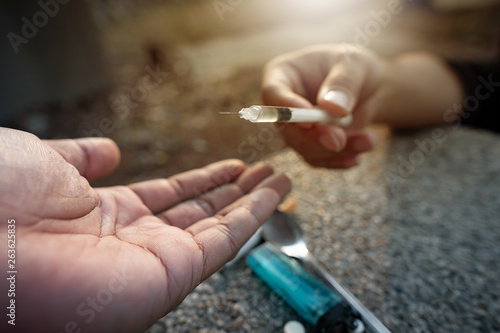 People are receiving addiction drug injection needles from other men