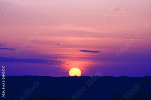 Beautiful sunrise over the mountain with purple background 