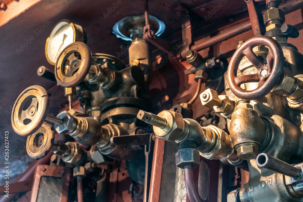 System of pipes and pressure regulating valve in the cabin of steam ...