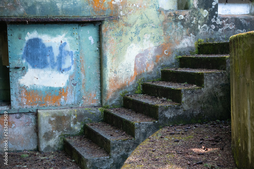 grungy  textured wall with painted surface and staircase