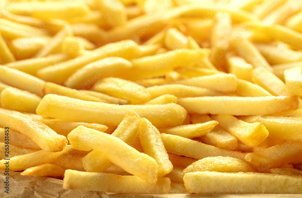 heap of fresh french fries as textured background heap of fresh french fries as textured background