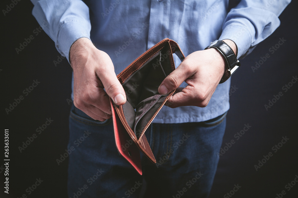 Foto Man holding empty wallet. Crisis